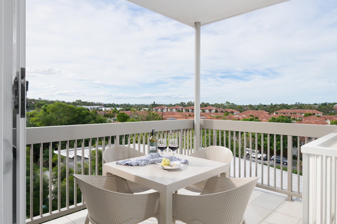 Private balcony with wine and cheese at sunset