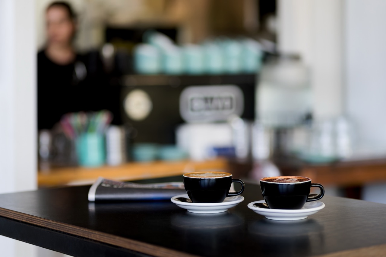 Two coffees on the counter at the BLVD cafe at street level on Endeavour Boulevard