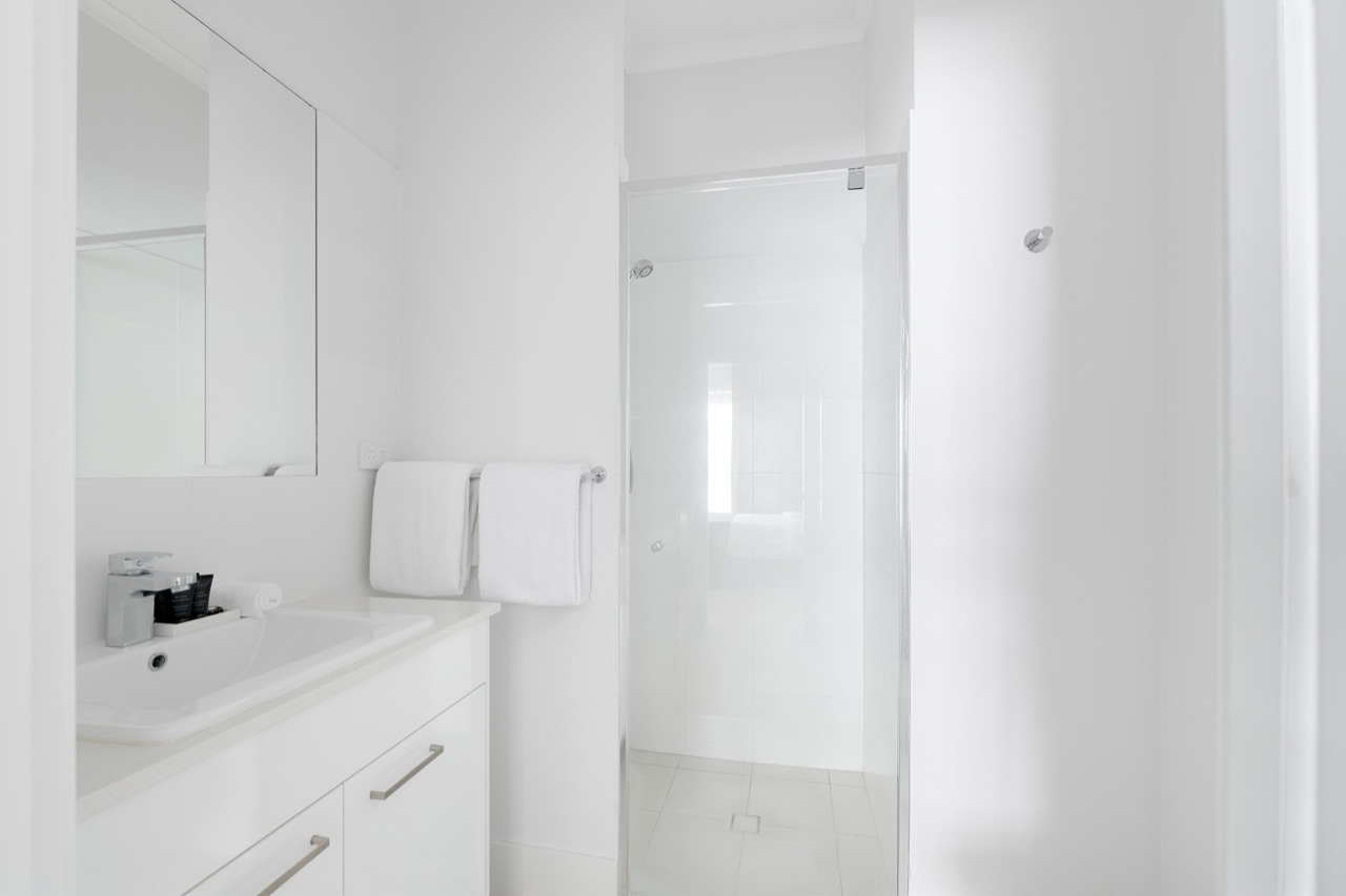 Penthouse ensuite with a sliding-door walk-in shower